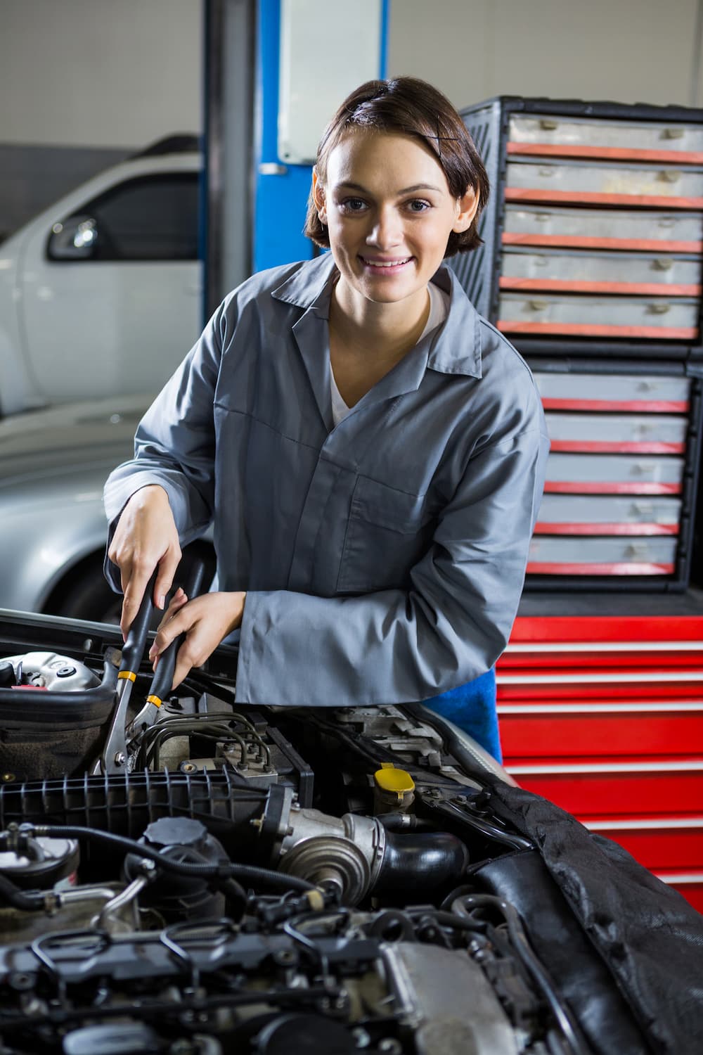female-mechanic-servicing-car (1)
